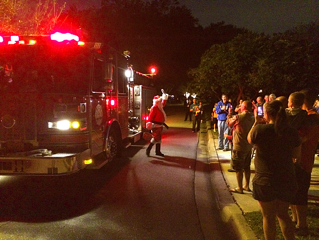 Santa steps out of the Fire Truck