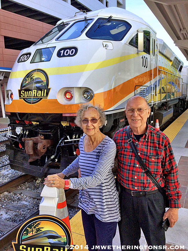 Cindy's parents pose for a shot in front of the engine car.