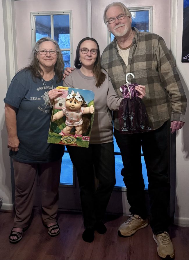Cindy, Ann, and me giving Ann a Cabbage Patch Kid baby (Princess Version).